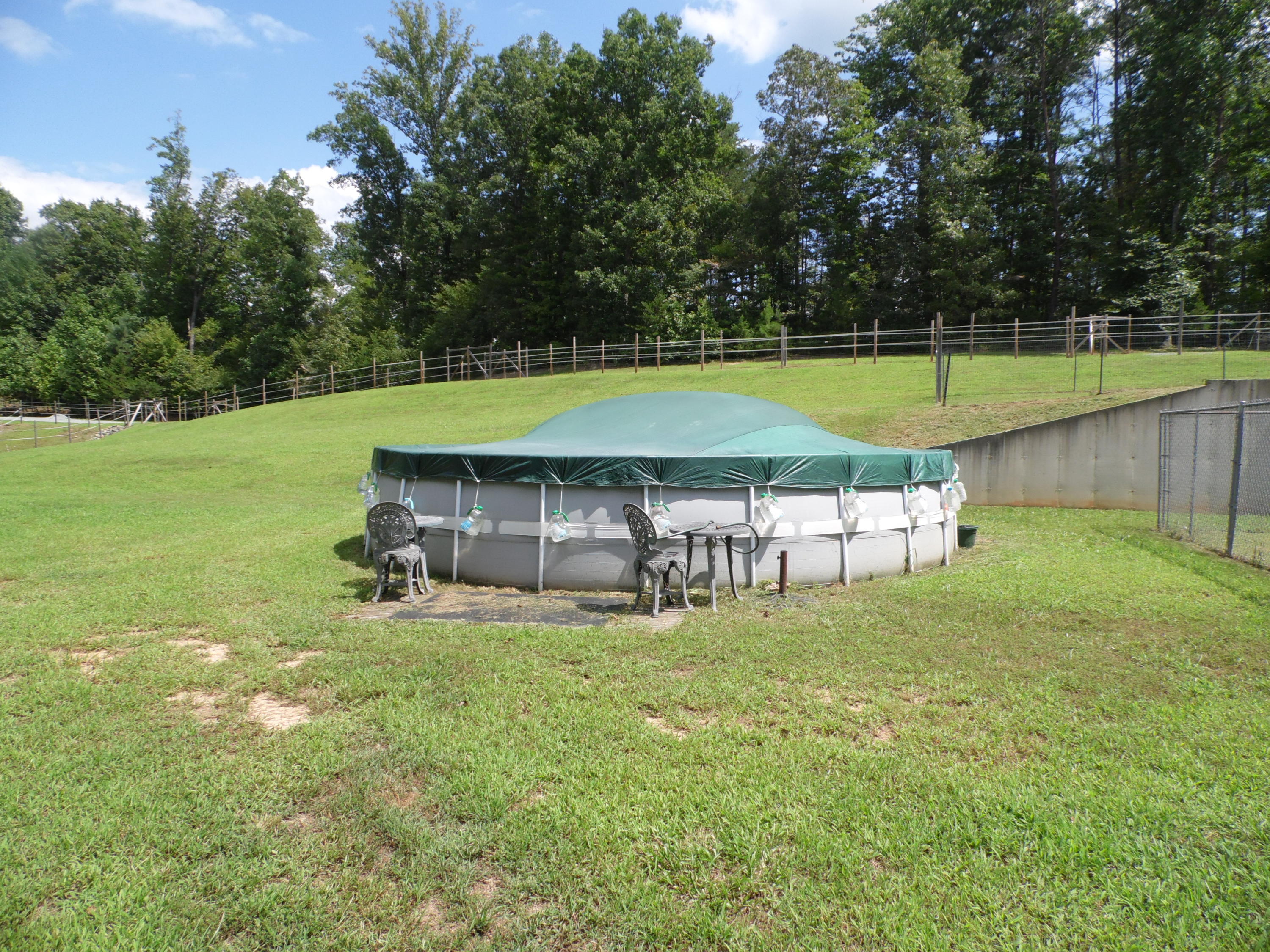 4020 Hatchett Road Penhook, VA 24137 - Photo 40 of 64 a view of a swimming pool with a yard