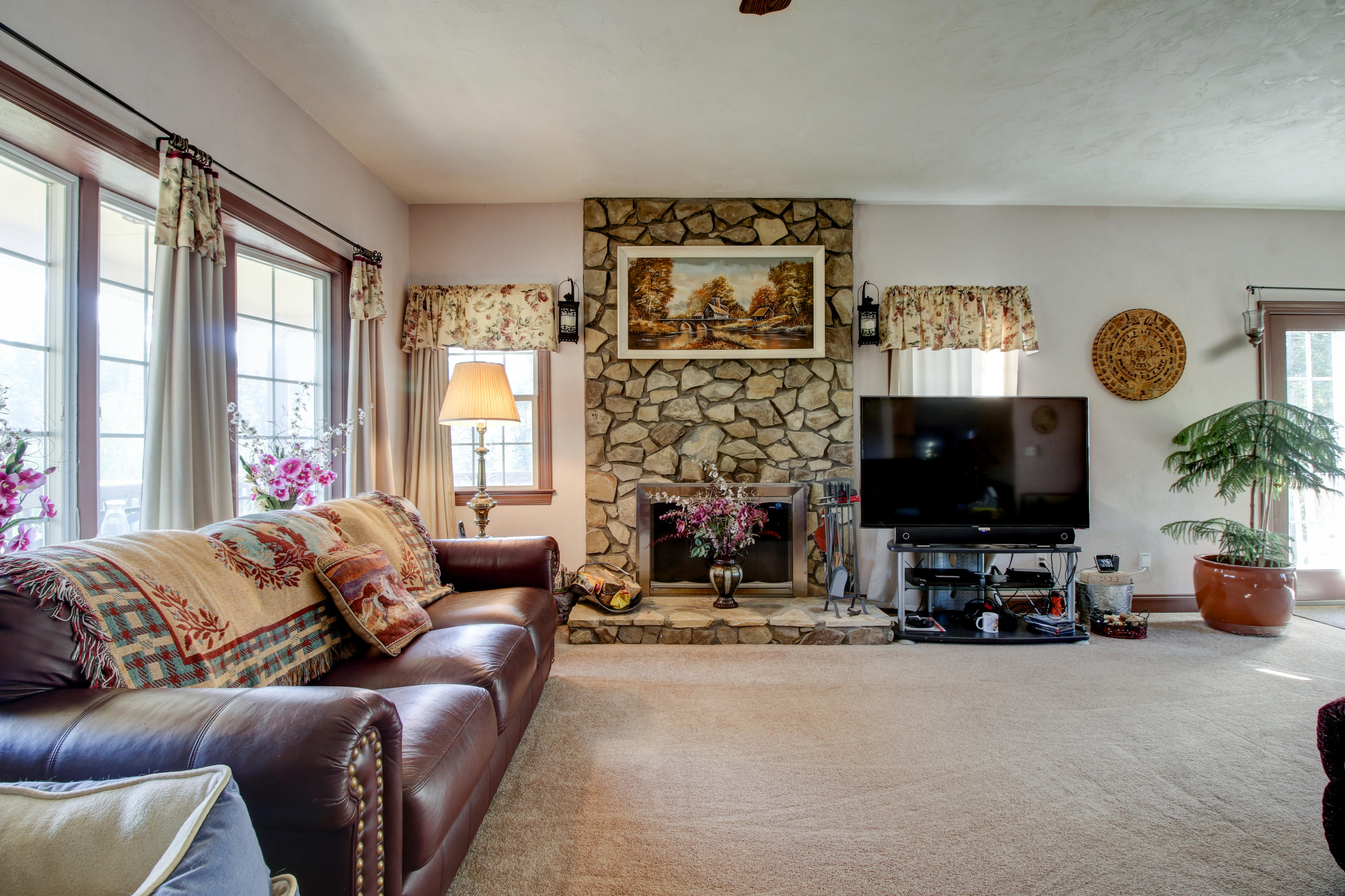 4020 Hatchett Road Penhook, VA 24137 - Photo 5 of 64 a living room with furniture a large window and a flat screen tv
