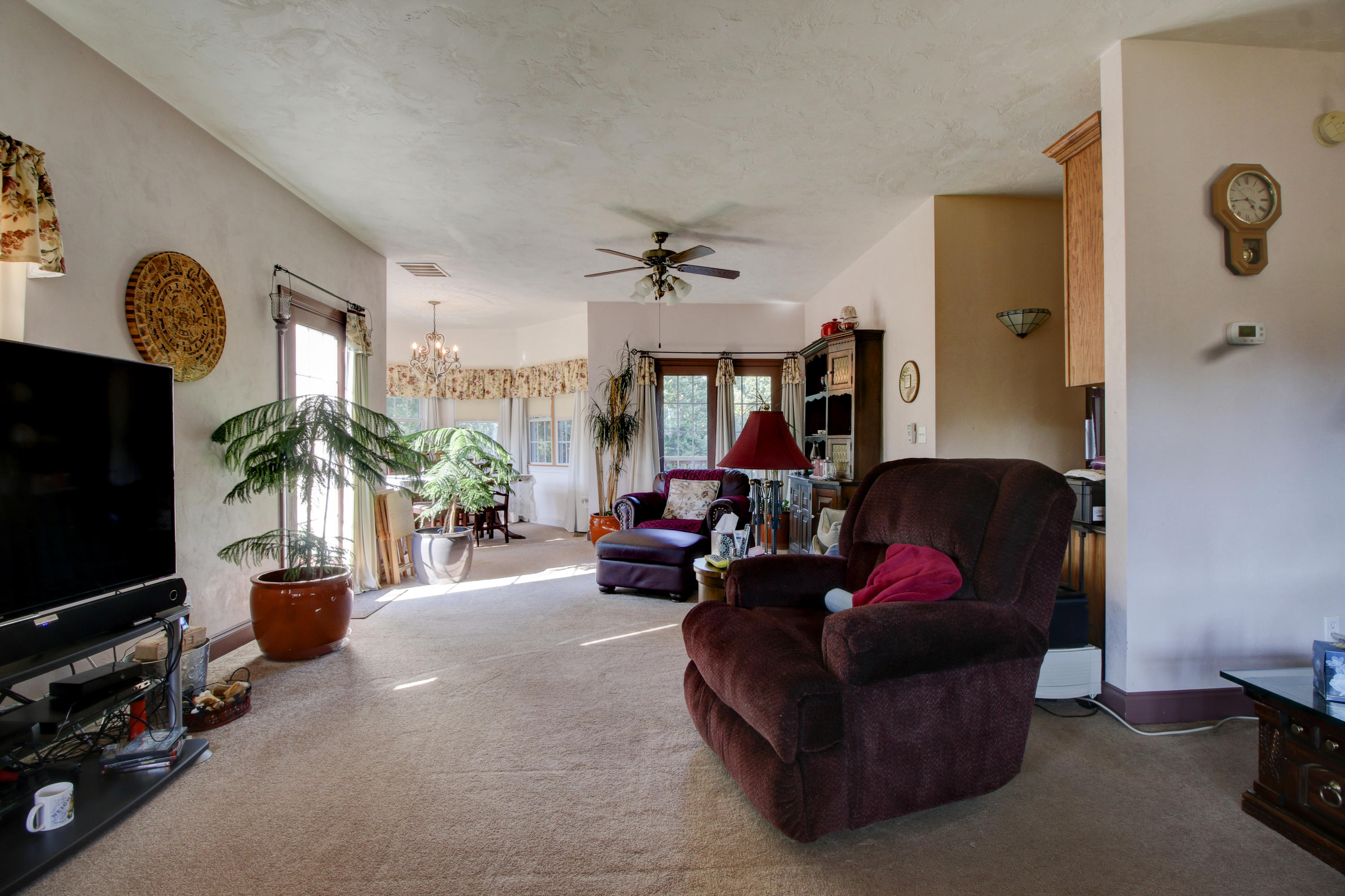 4020 Hatchett Road Penhook, VA 24137 - Photo 6 of 64 a living room with furniture a flat screen tv and a window