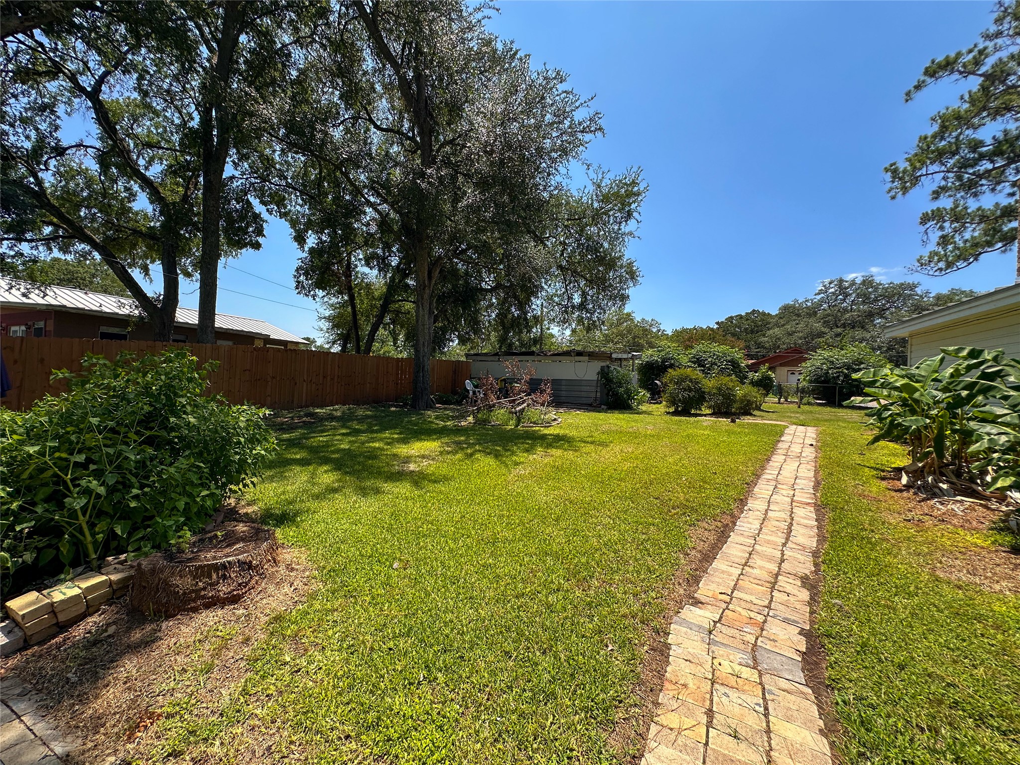 407 4th Avenue Smithville, TX 78957 - Photo 17 of 37 a view of a swimming pool with a garden
