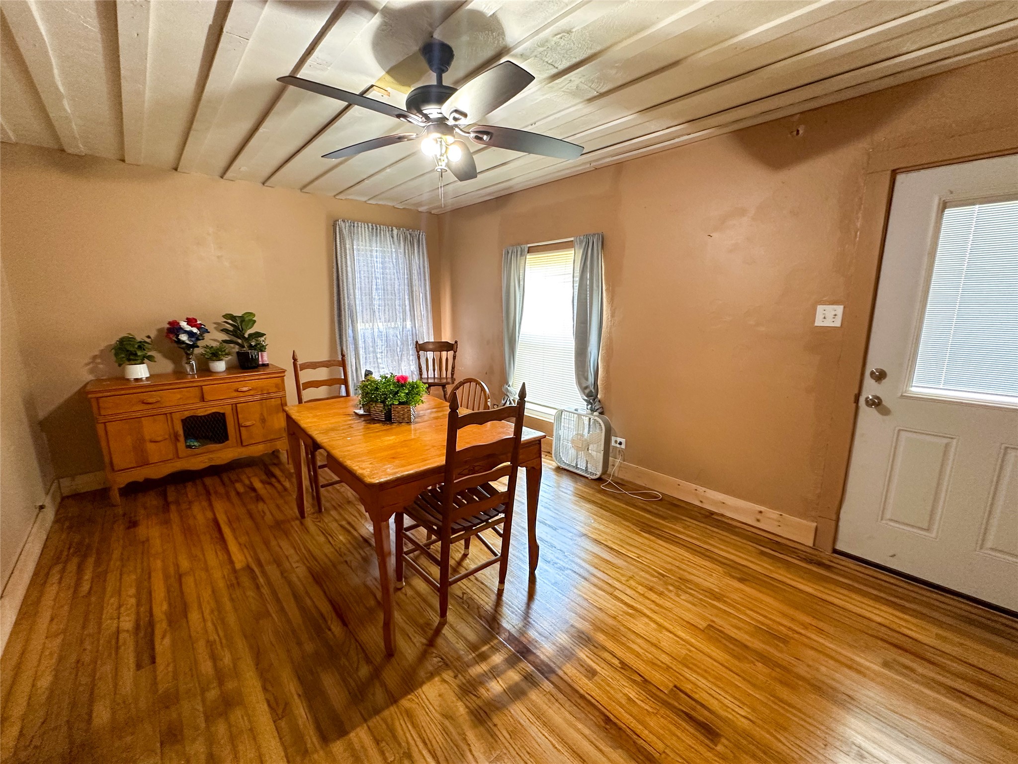 407 4th Avenue Smithville, TX 78957 - Photo 22 of 37 a view of a dining room with furniture and wooden floor