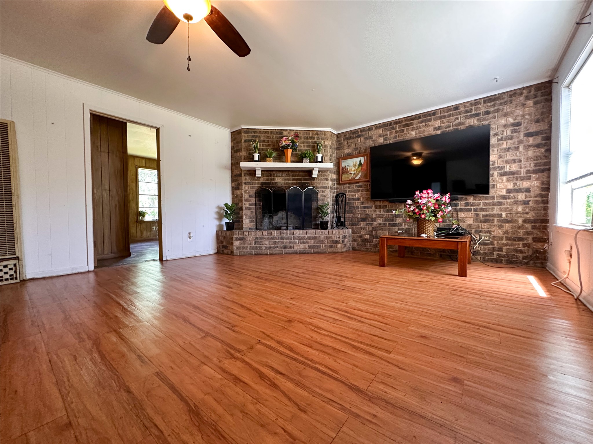 407 4th Avenue Smithville, TX 78957 - Photo 29 of 37 a view of a room with wooden floor and chandelier