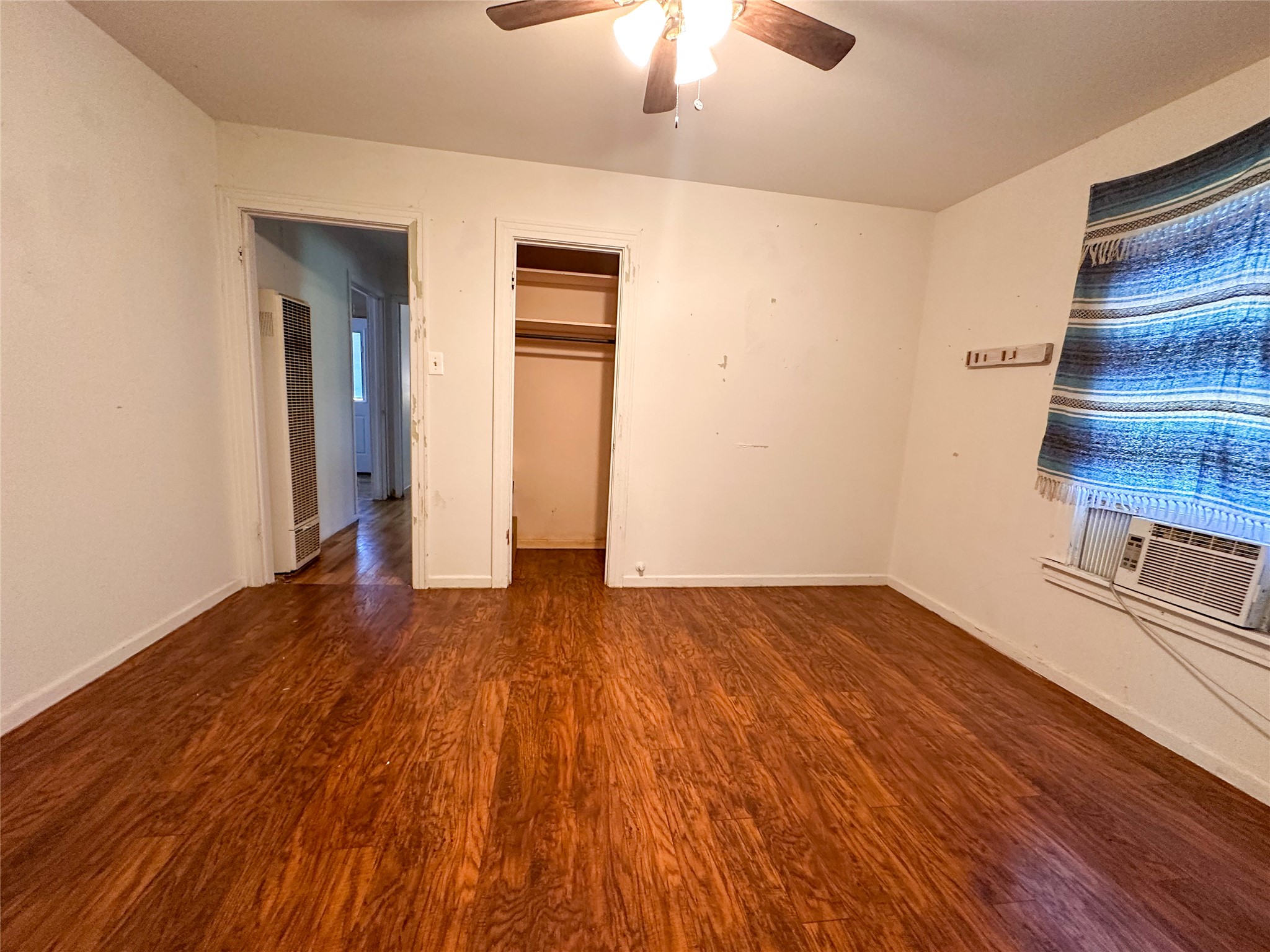 407 4th Avenue Smithville, TX 78957 - Photo 34 of 37 wooden floor in an empty room with a window
