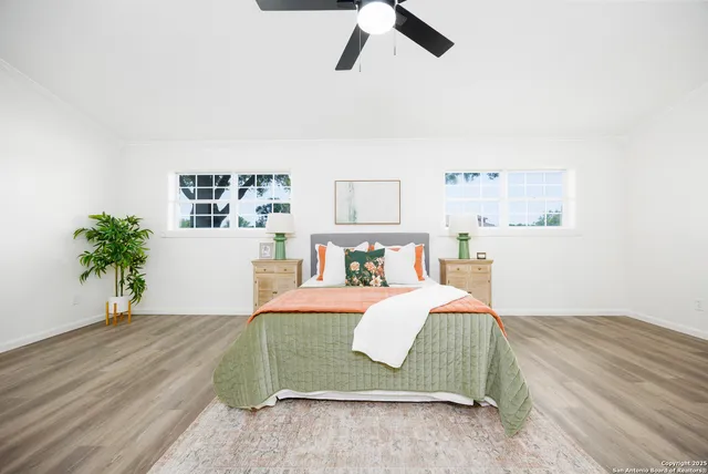 a bedroom with a bed and closet with wooden floor