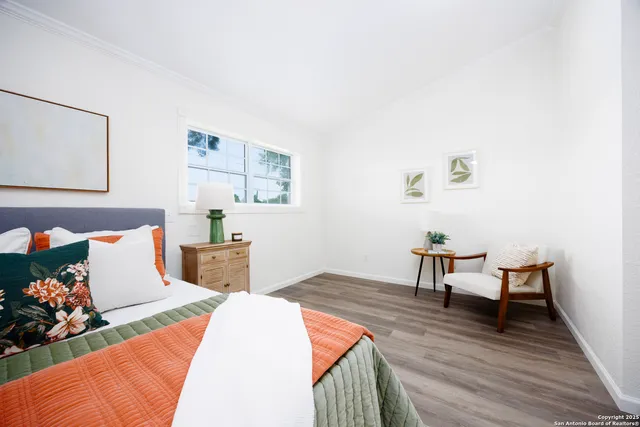 a bedroom with a bed and a table in it