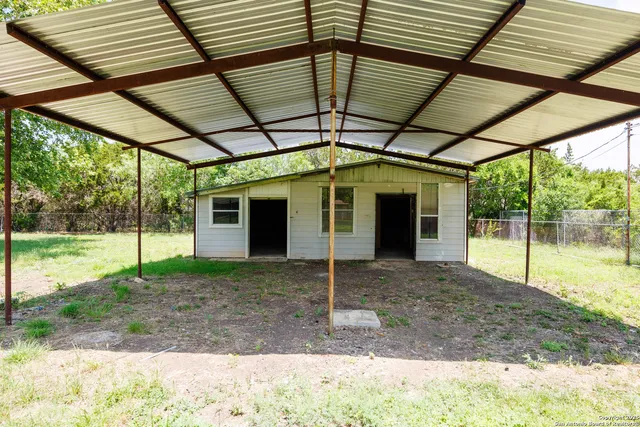 a view of a backyard with garden
