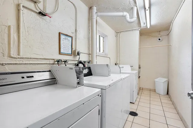 a view of bathroom with a sink and mirror