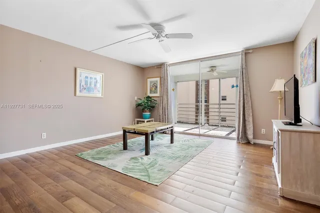 a view of a livingroom with furniture and wooden floor