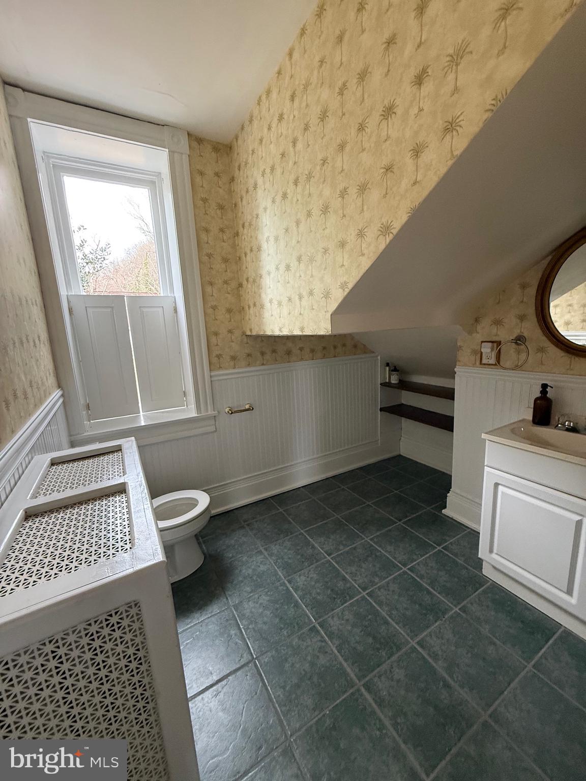 1 Center Street, Unit MAIN Port Deposit, MD 21904 - Photo 13 of 14 a bathroom with a toilet a sink a window and vanity