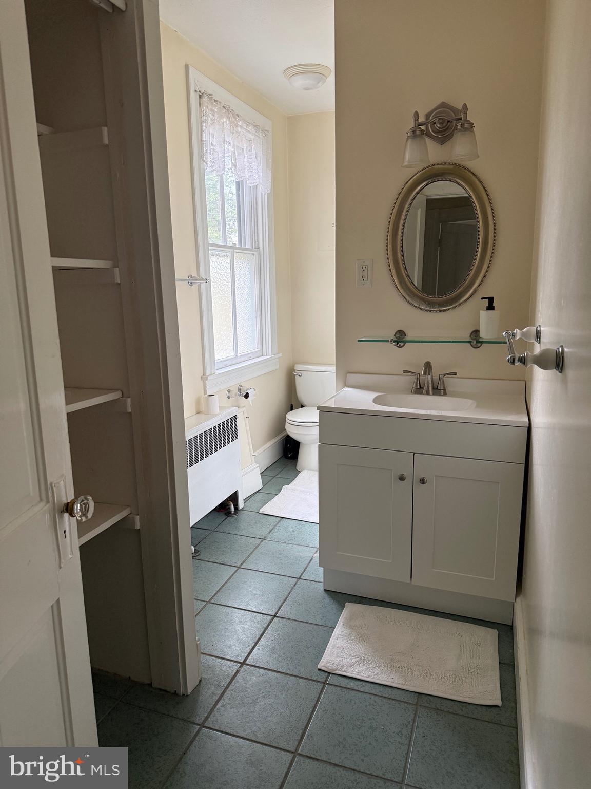 1 Center Street, Unit MAIN Port Deposit, MD 21904 - Photo 10 of 14 a bathroom with a sink a toilet and a window