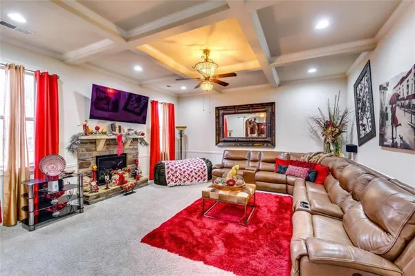 a living room with furniture toys and a flat screen tv
