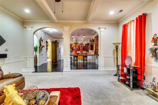 a living room with lots of furniture and a flat screen tv