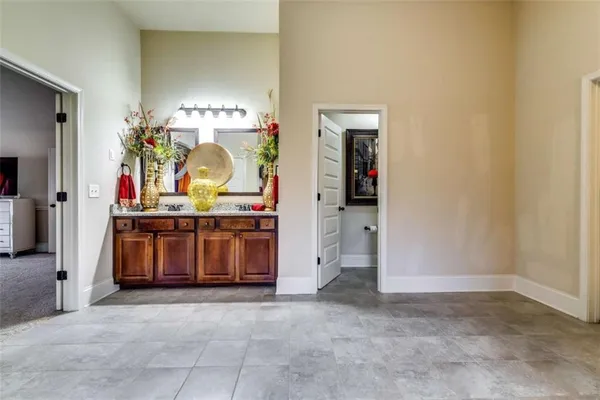 a view of hall way with furniture