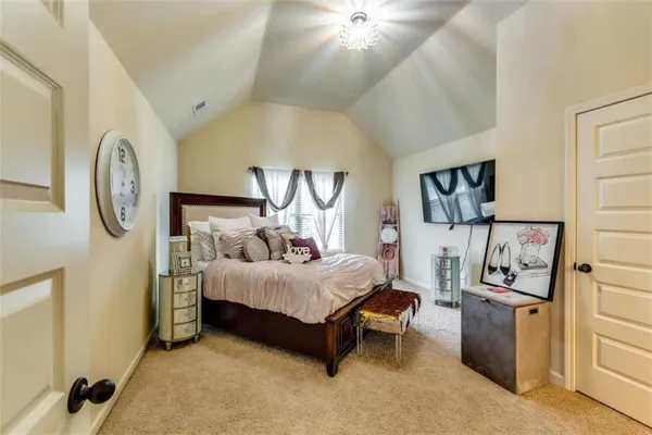 a bedroom with a bed and a cabinets