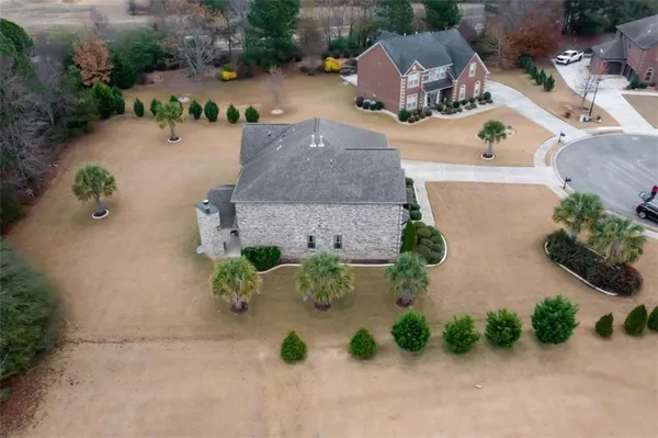 an aerial view of a house with outdoor space