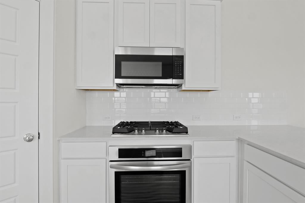 317 Millwood Road Lavon, TX 75166 - Photo 8 of 17 Kitchen in the Pecan II home plan by Trophy Signature Homes – REPRESENTATIVE PHOTO