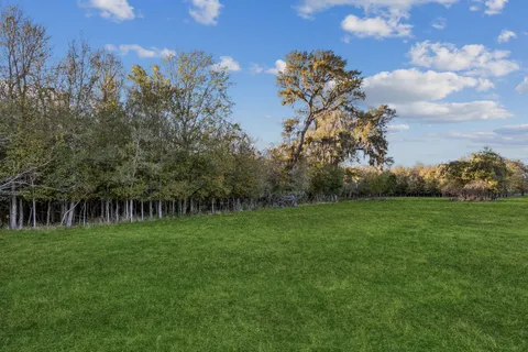 a view of a golf course with a lake