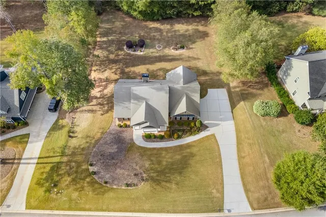 a view of a swimming pool with a yard
