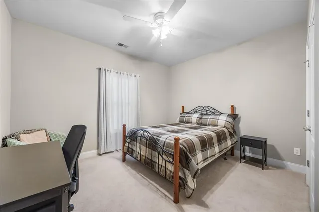 a bathroom with a sink toilet a mirror and shower curtain