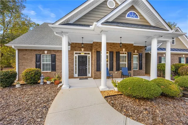 a front view of a house with garden