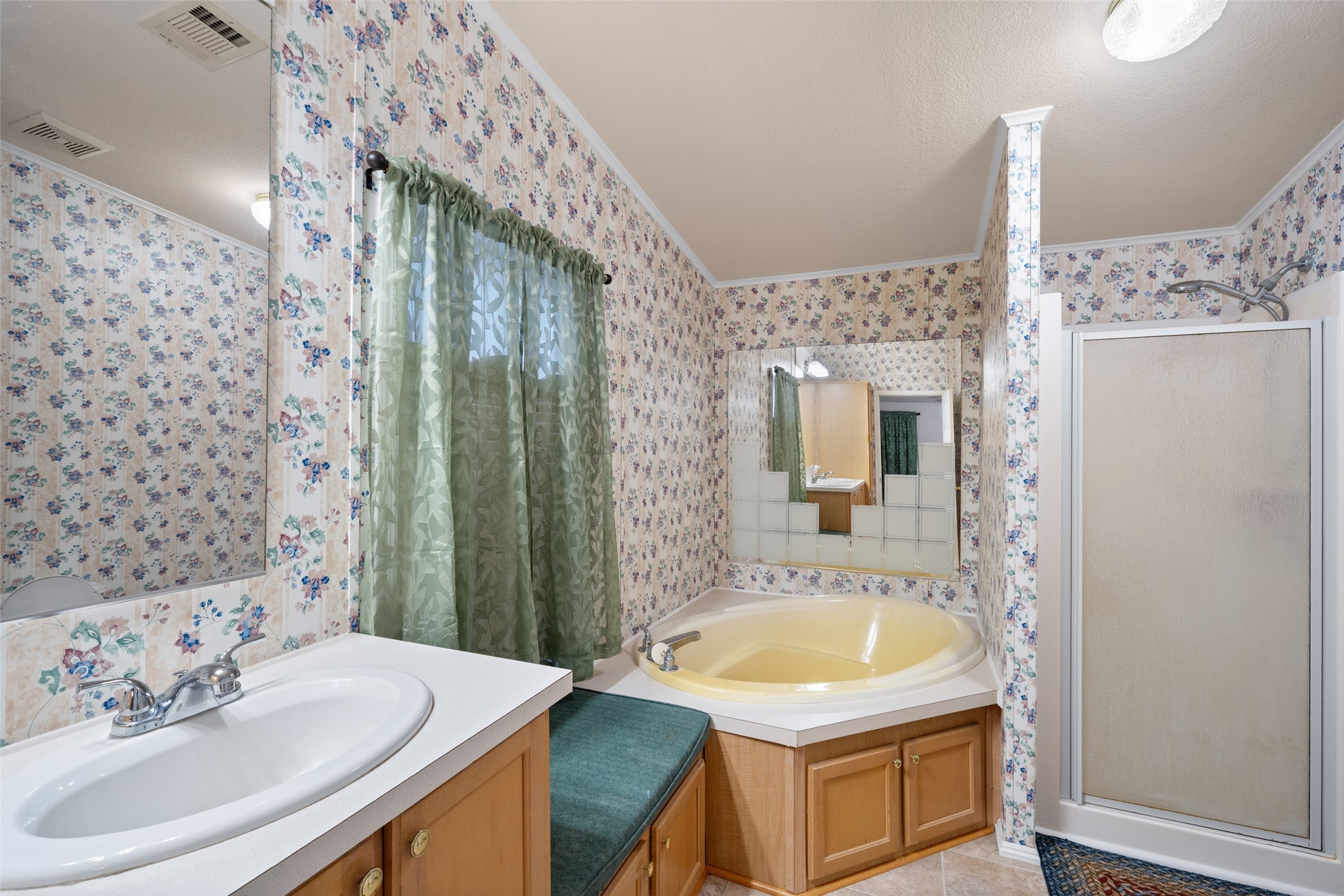 31351 Buckeye Road Waller, TX 77484 - Photo 12 of 36 a bathroom with a tub sink and mirror
