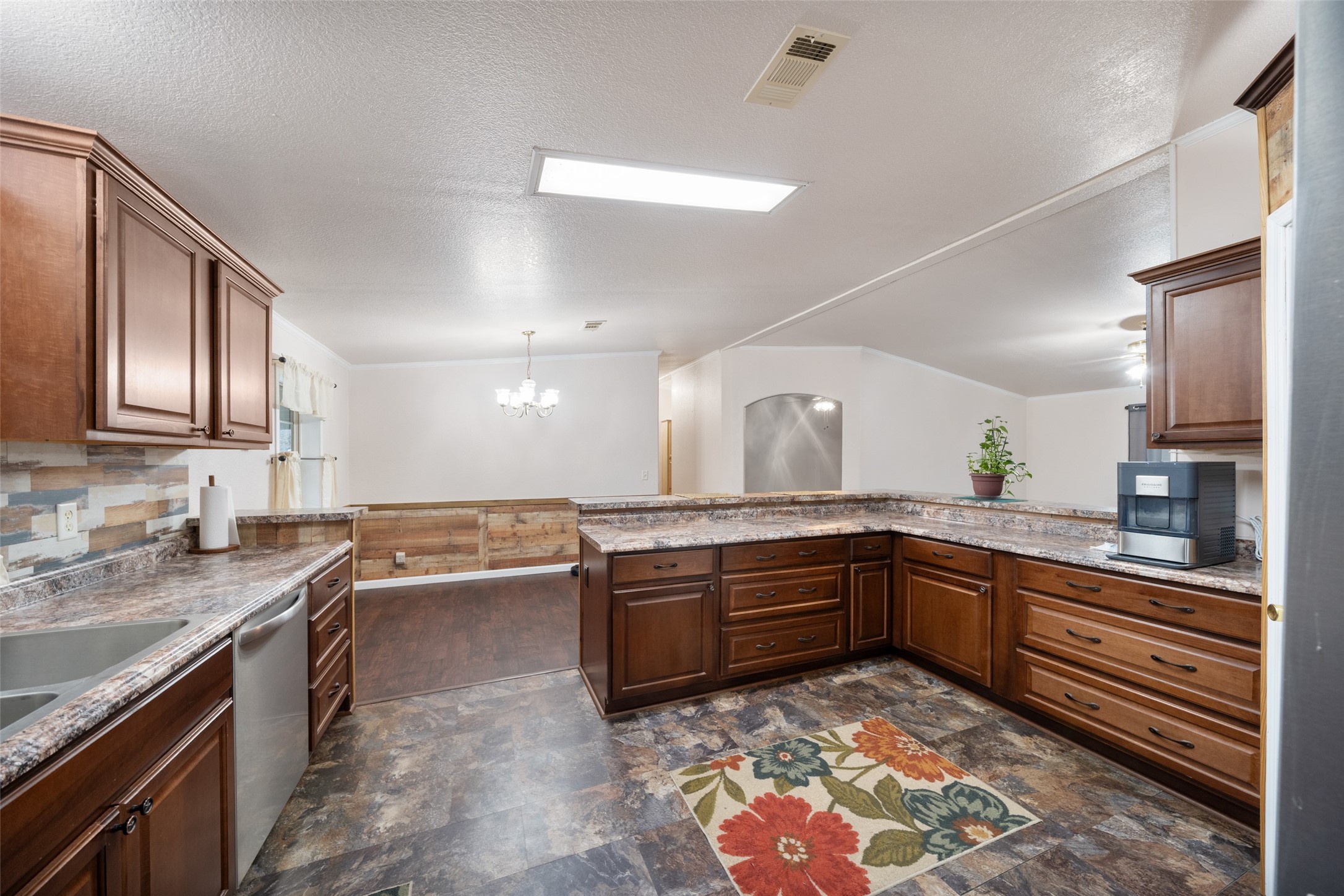 31351 Buckeye Road Waller, TX 77484 - Photo 16 of 36 a large kitchen with stainless steel appliances granite countertop a sink and dishwasher a stove with wooden floor
