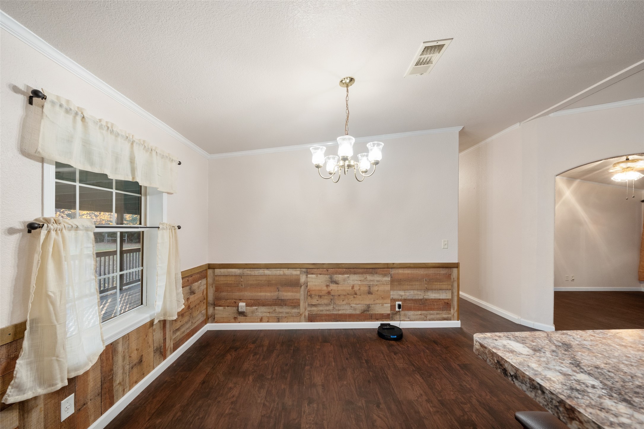 31351 Buckeye Road Waller, TX 77484 - Photo 21 of 36 a view of a bedroom with wooden floor and a ceiling fan