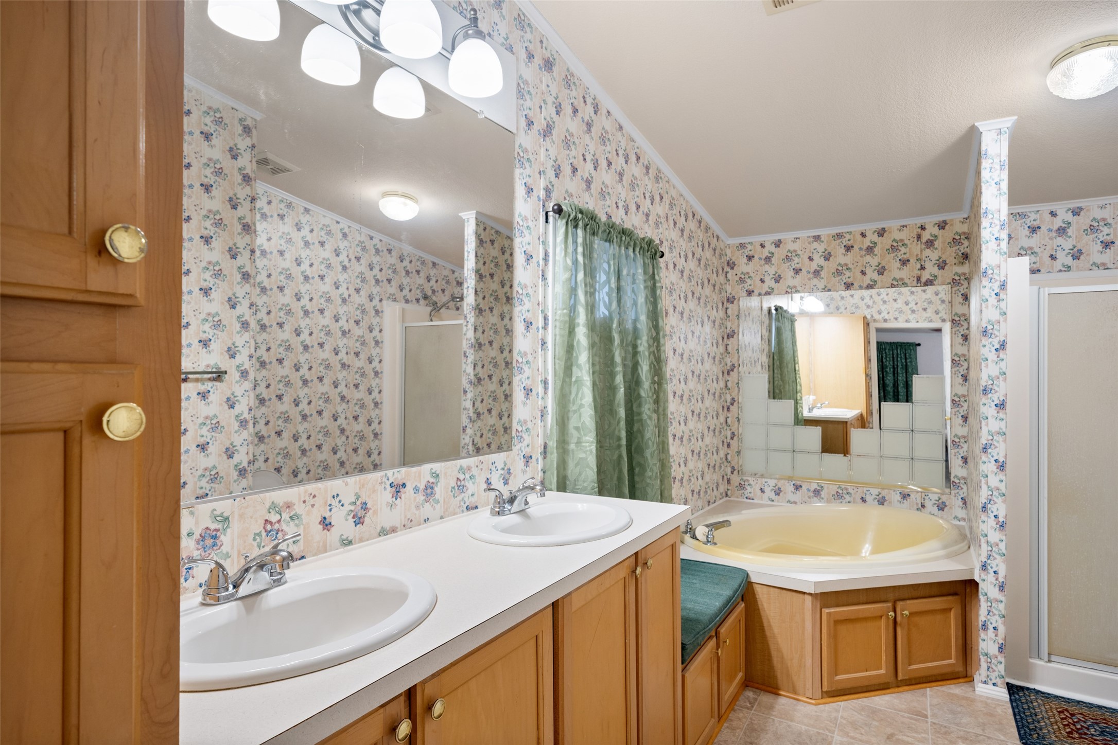 31351 Buckeye Road Waller, TX 77484 - Photo 25 of 36 a bathroom with a sink double vanity and a mirror