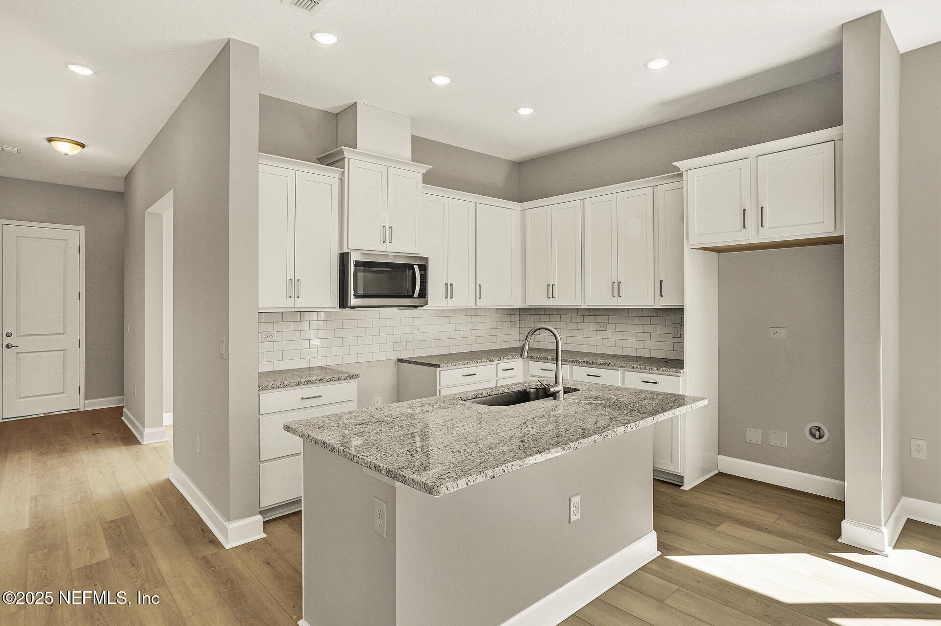 42 Tillia Trail St. Augustine, FL 32092 - Photo 10 of 18 a kitchen with stainless steel appliances granite countertop a sink a stove and a refrigerator