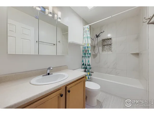 a bathroom with a sink toilet a bathtub and shower