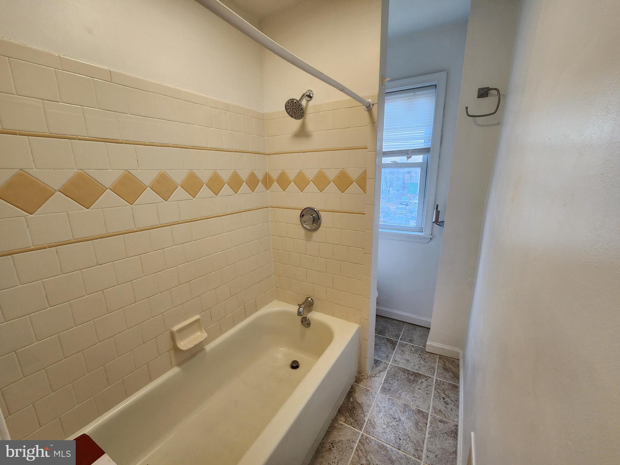 1213 East Lanvale Street Baltimore, MD 21202 - Photo 18 of 22 a bathroom with a tub a sink and a shower