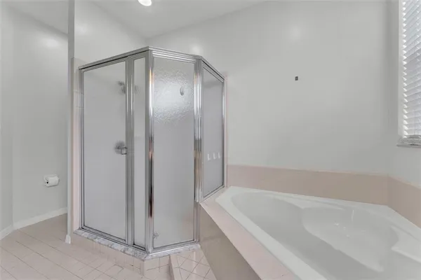 a bathroom with a bathtub and a sink