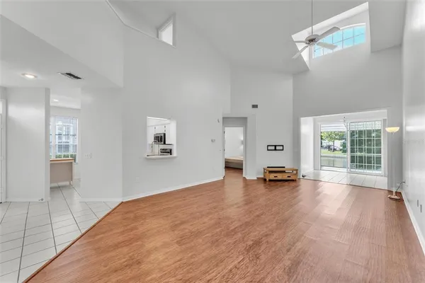 a view of a room with wooden floor and window