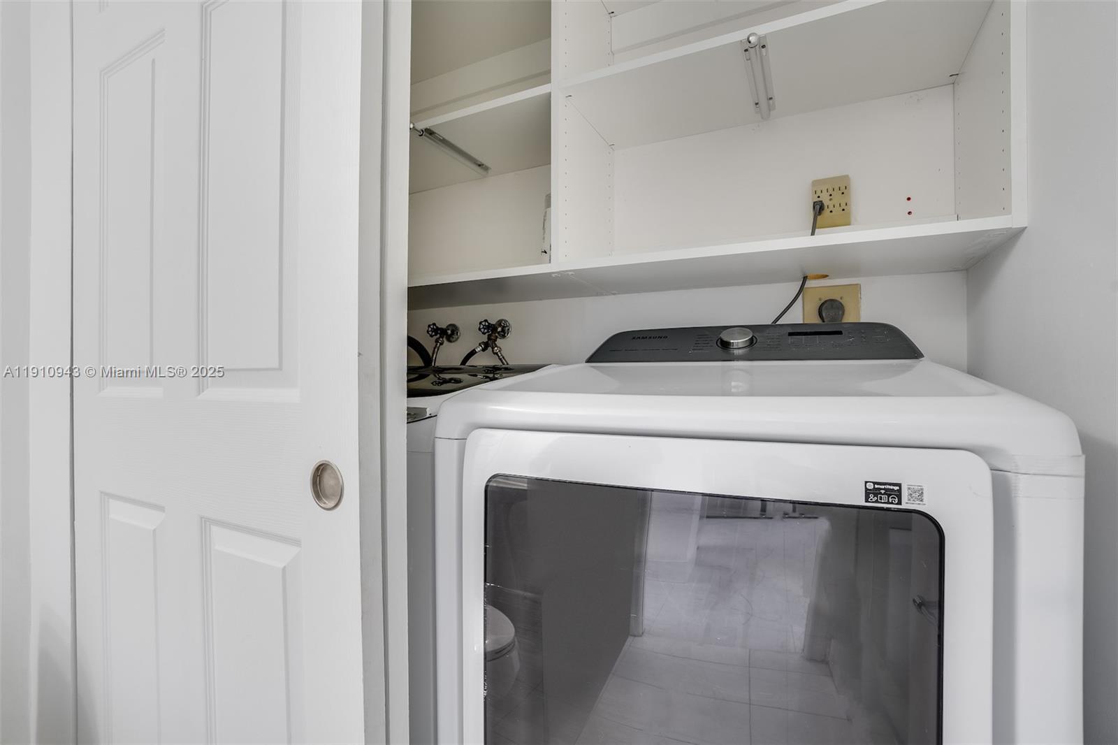 3500 Mystic Pointe Drive, Unit 1205 Aventura, FL 33180 - Photo 27 of 35 a utility room with dryer and washer