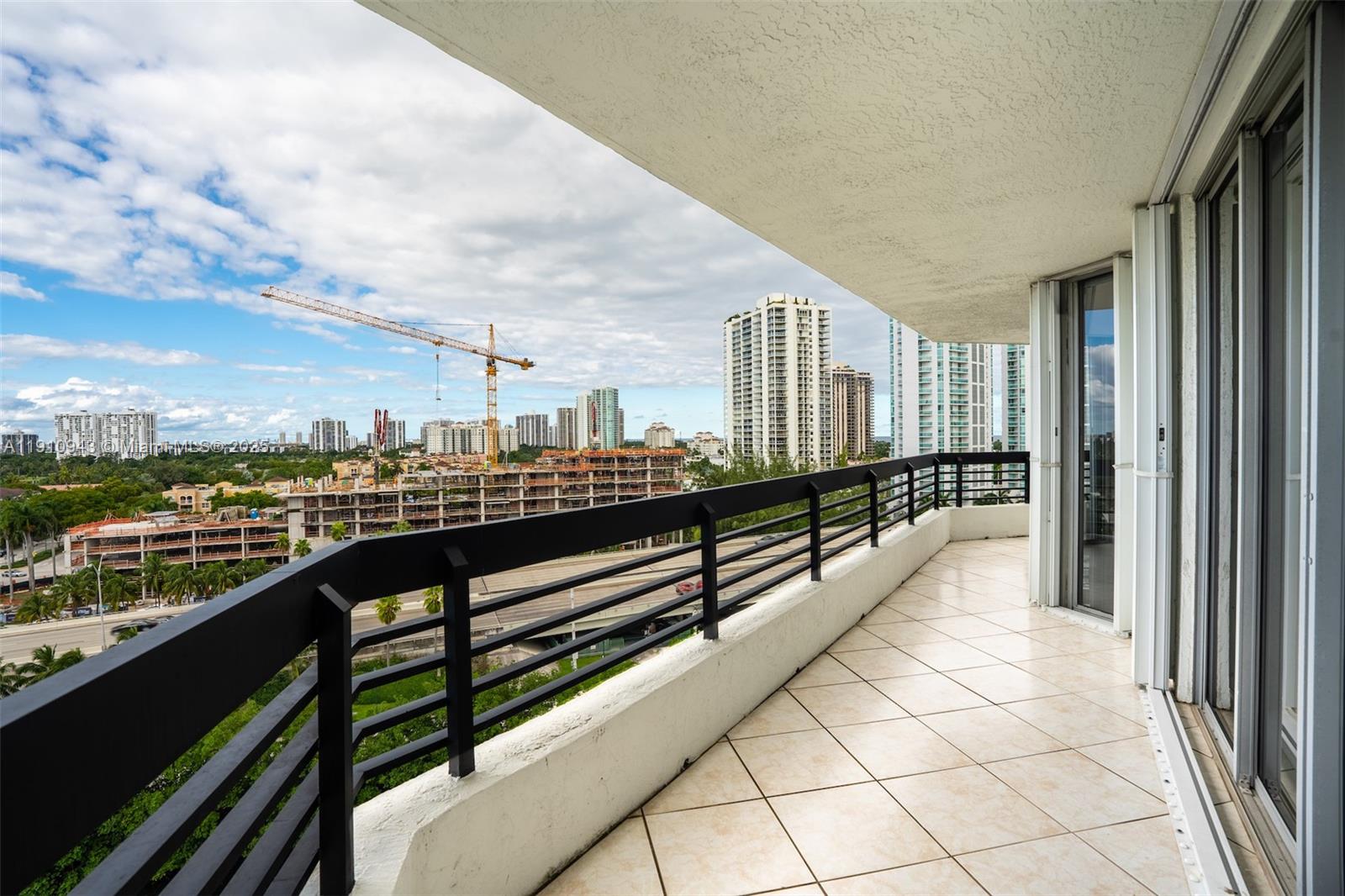 3500 Mystic Pointe Drive, Unit 1205 Aventura, FL 33180 - Photo 30 of 35 a view of city from a balcony