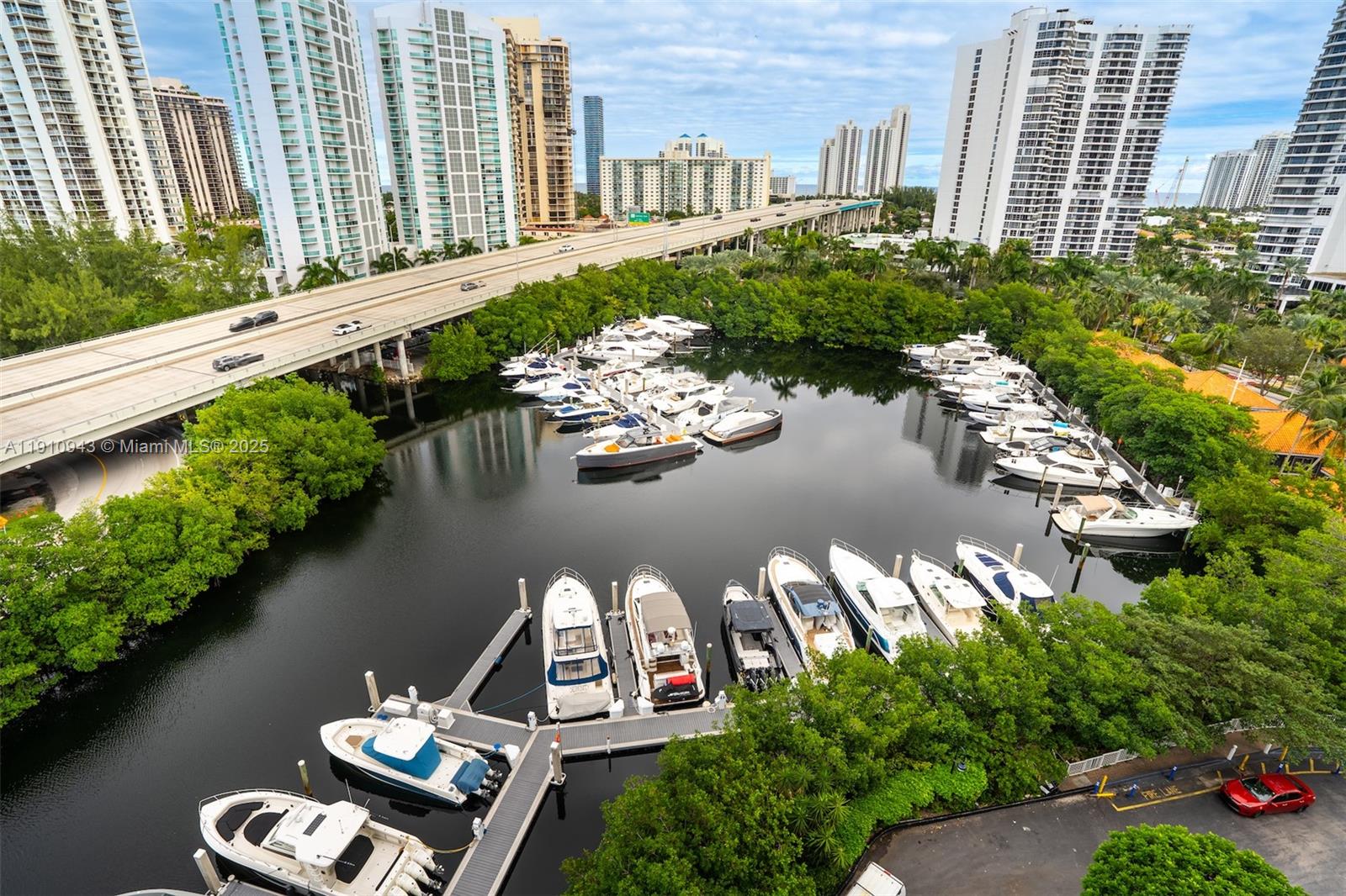 3500 Mystic Pointe Drive, Unit 1205 Aventura, FL 33180 - Photo 33 of 35 a view of a lake with a yard and outdoor seating