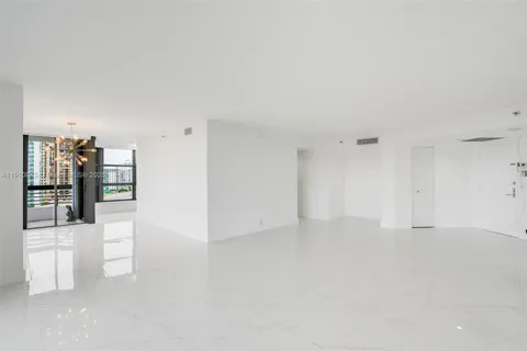 a view of an empty room with glass door