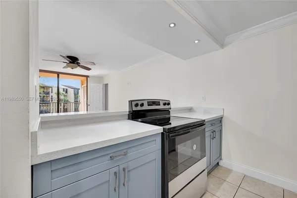 a kitchen with a stove and a microwave
