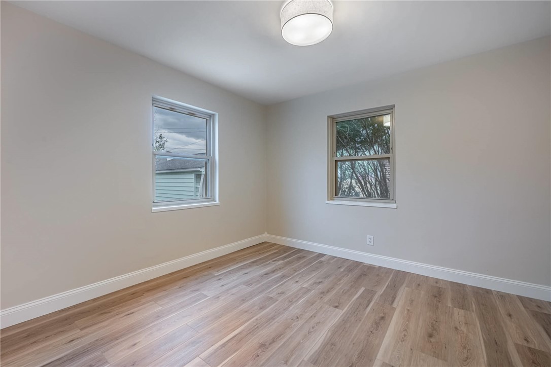 1012 Hampshire Road Dayton, OH 45419 - Photo 21 of 39 This inviting bedroom features natural light and durable flooring, offering a comfortable personal space.