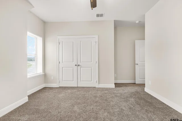 a view of front door of house with stairs