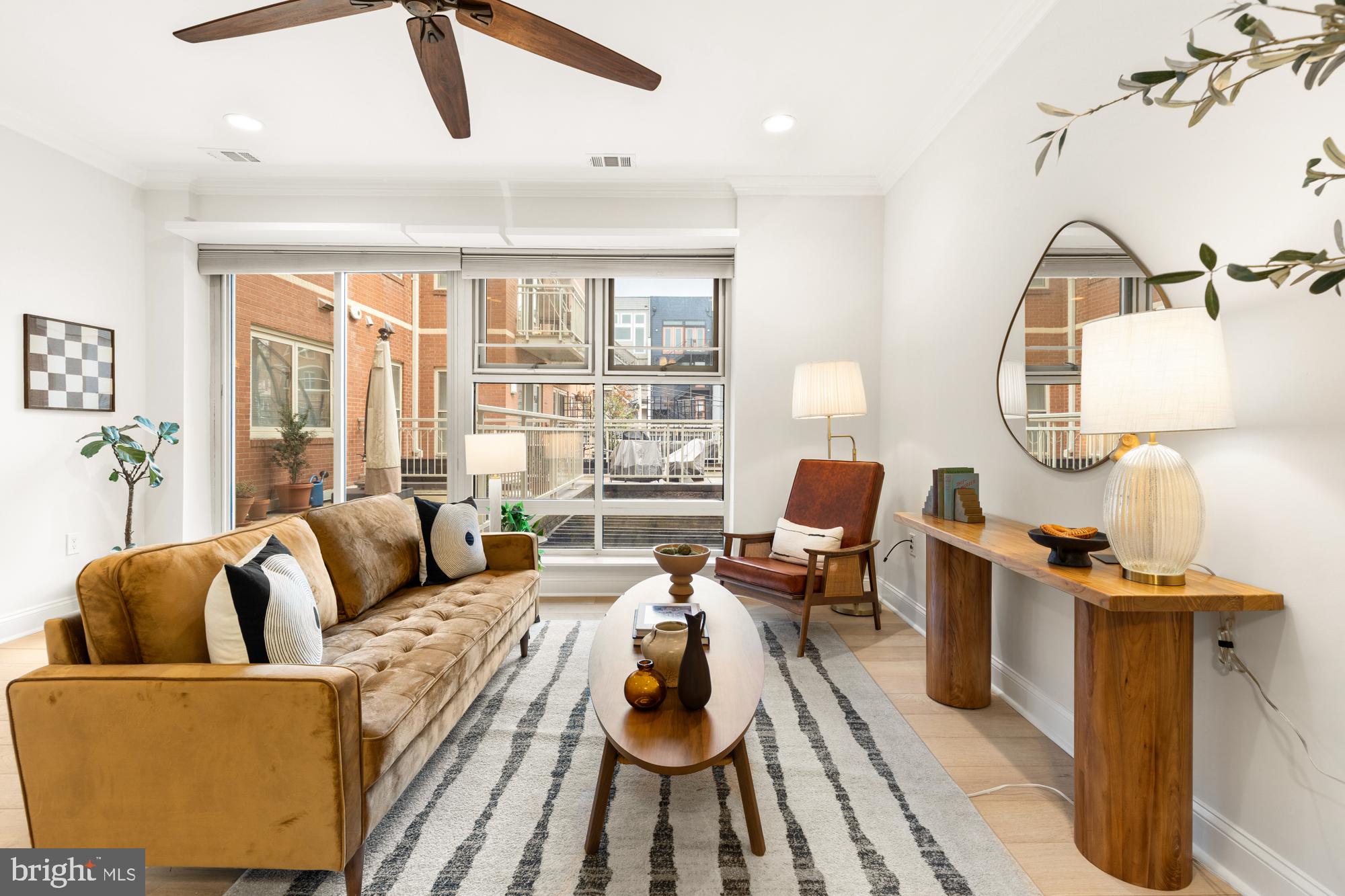 1464 Harvard Street Northwest, Unit 3 Washington, DC 20009 - Photo 11 of 24 a living room with furniture and a large window