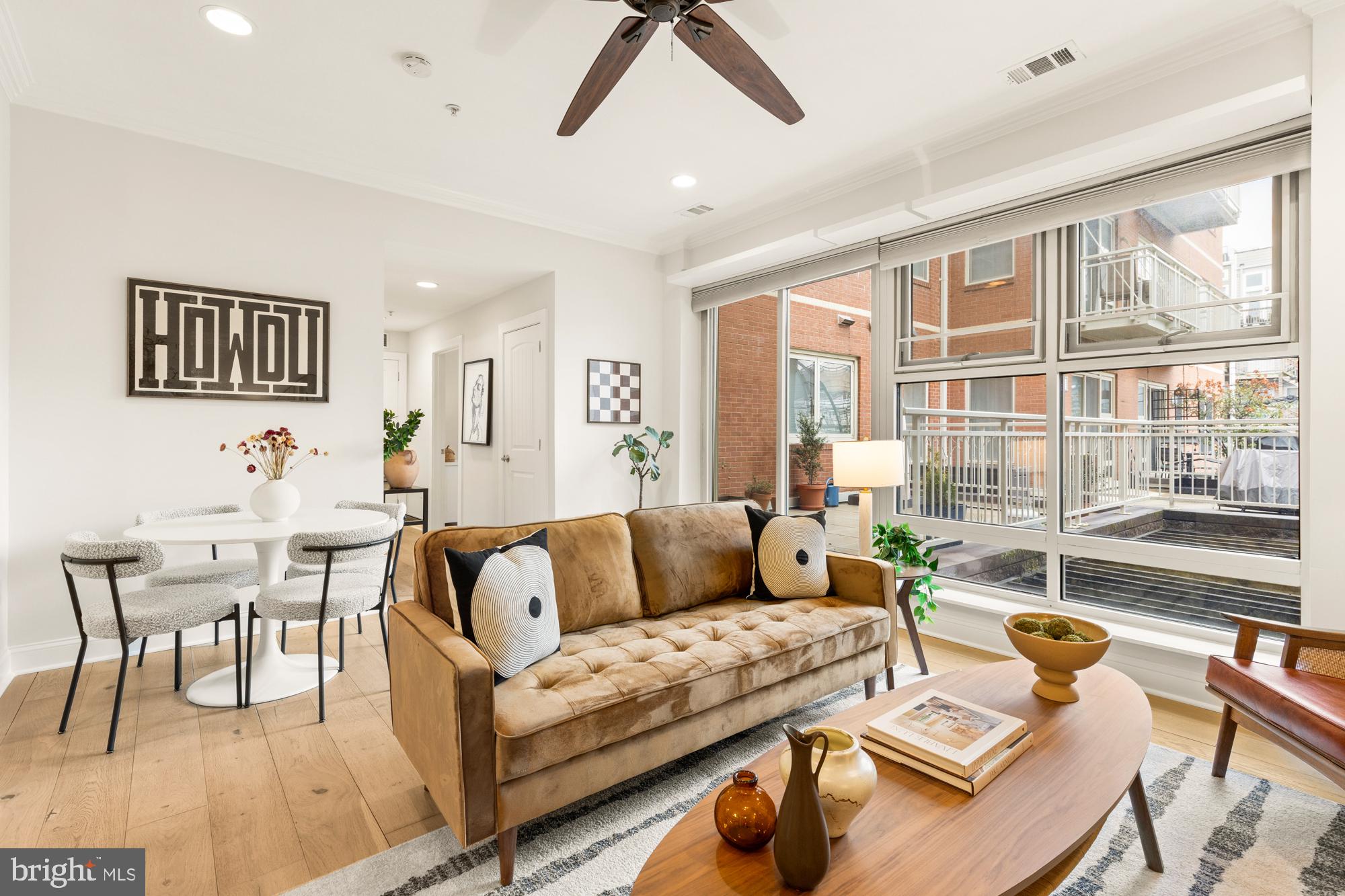 1464 Harvard Street Northwest, Unit 3 Washington, DC 20009 - Photo 12 of 24 a living room with furniture and a large window
