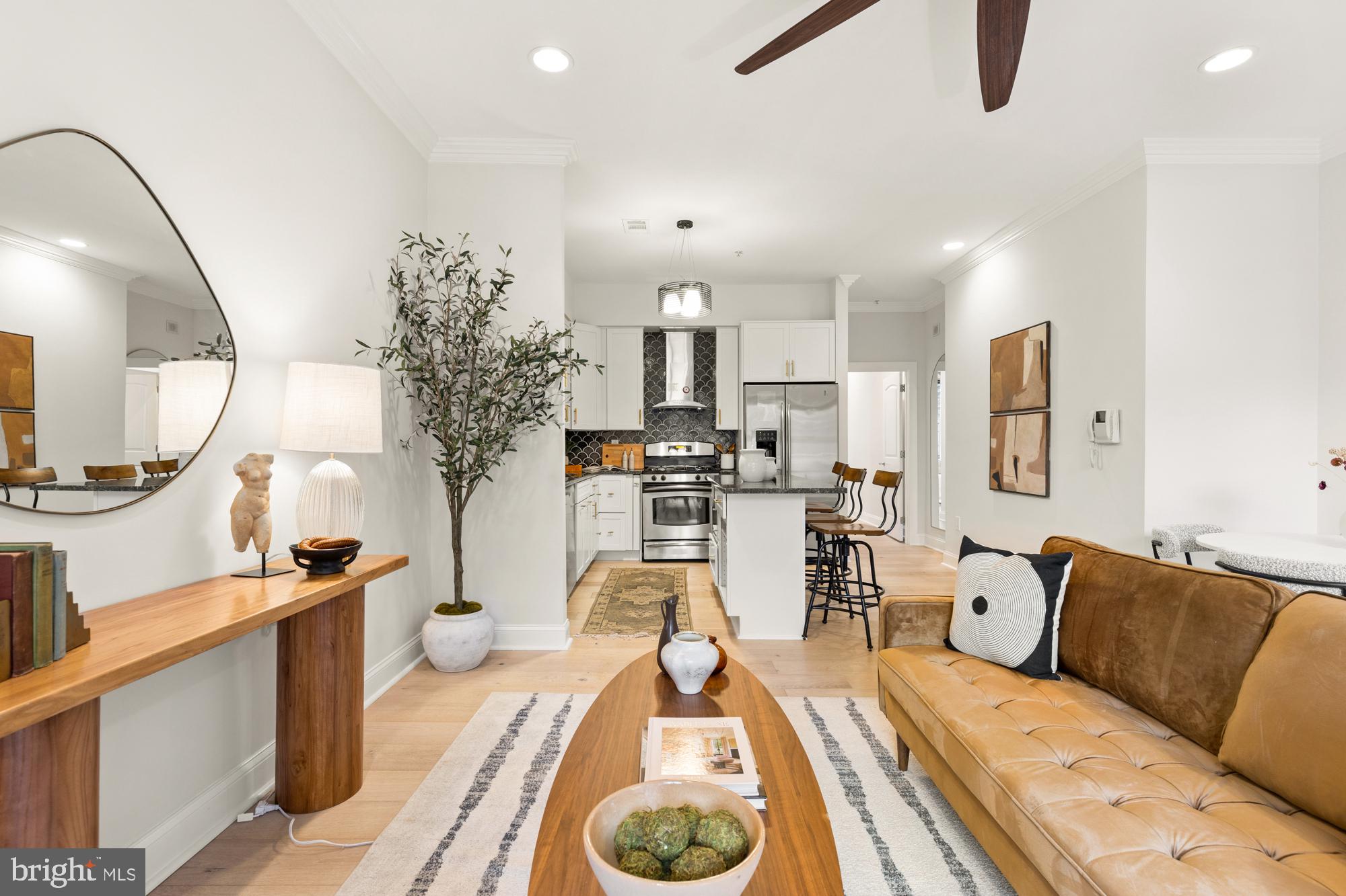 1464 Harvard Street Northwest, Unit 3 Washington, DC 20009 - Photo 14 of 24 a living room with furniture and a wooden floor