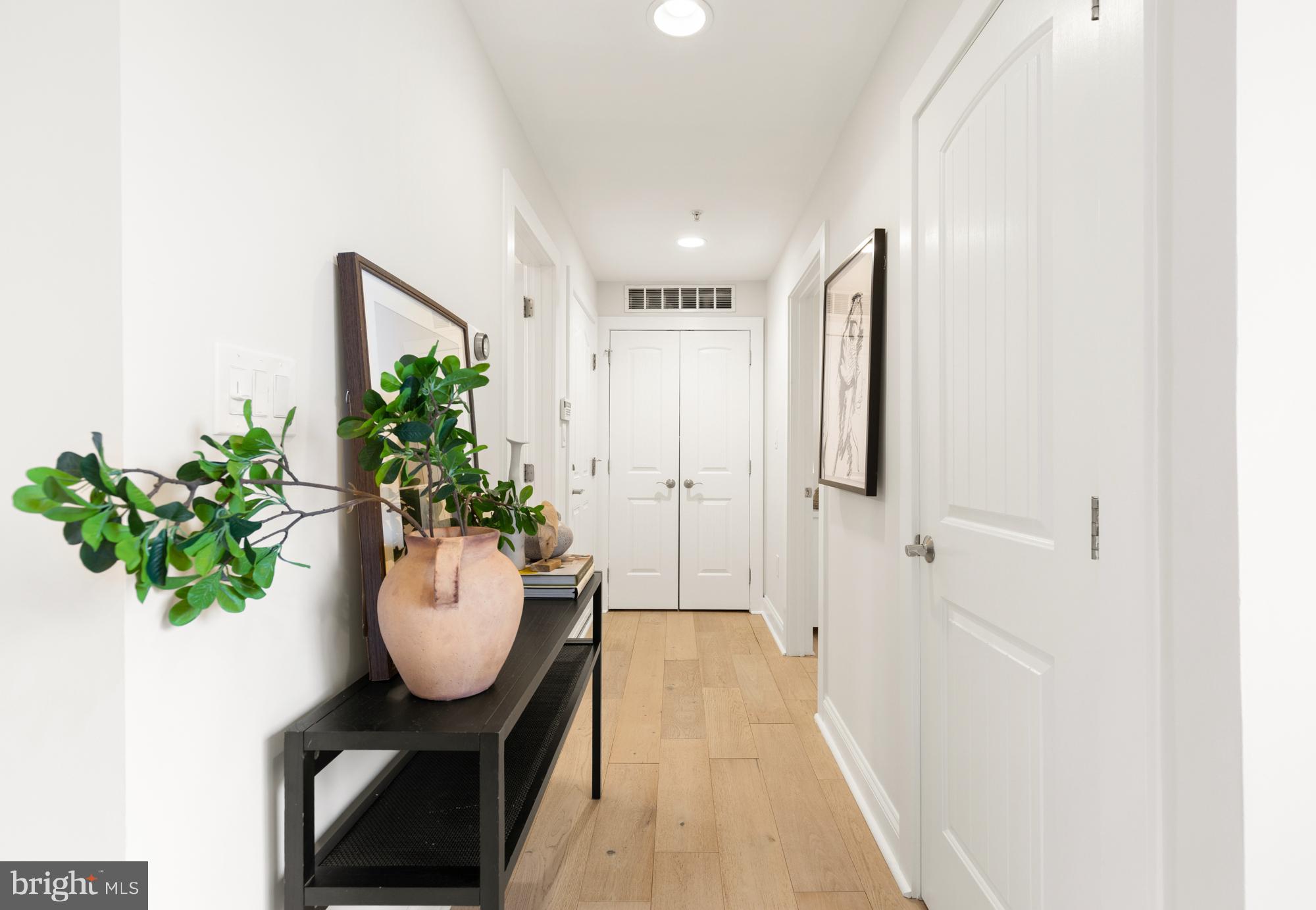 1464 Harvard Street Northwest, Unit 3 Washington, DC 20009 - Photo 4 of 24 a view of a hallway to dining room and wooden floor