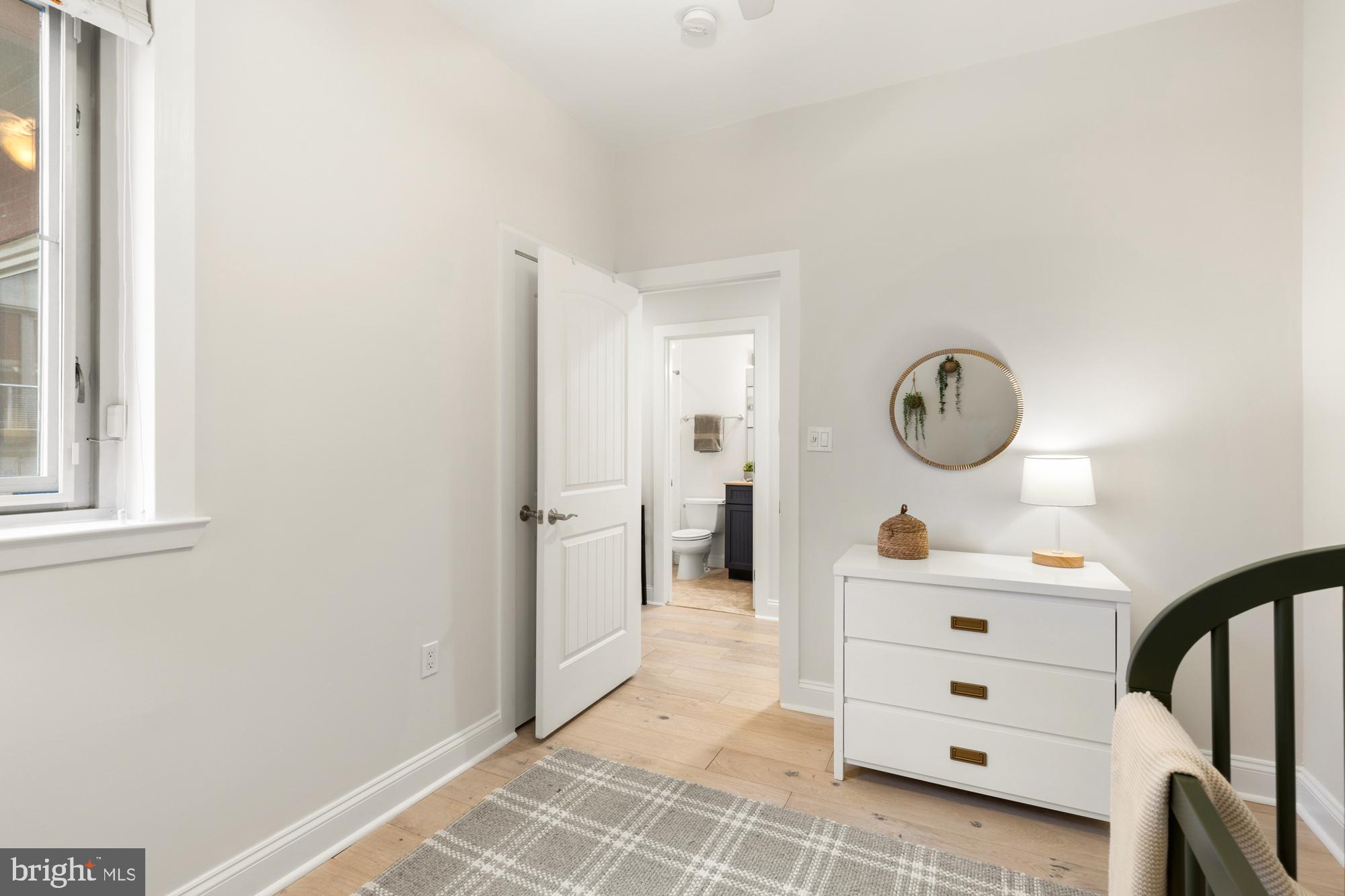 1464 Harvard Street Northwest, Unit 3 Washington, DC 20009 - Photo 6 of 24 a view of a hallway to a livingroom and a window