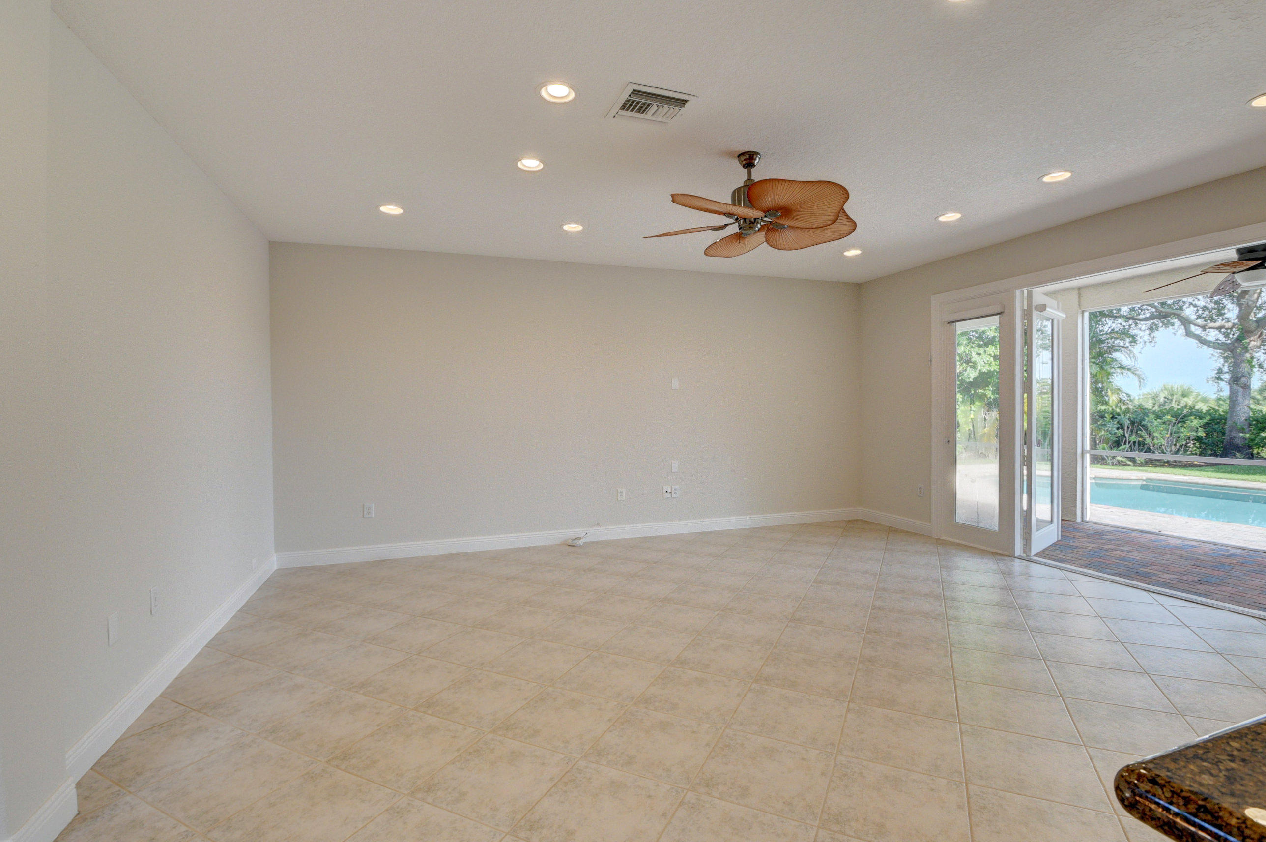 11785 Preservation Lane Boca Raton, FL 33498 - Photo 12 of 53 an empty space and chandelier fan
