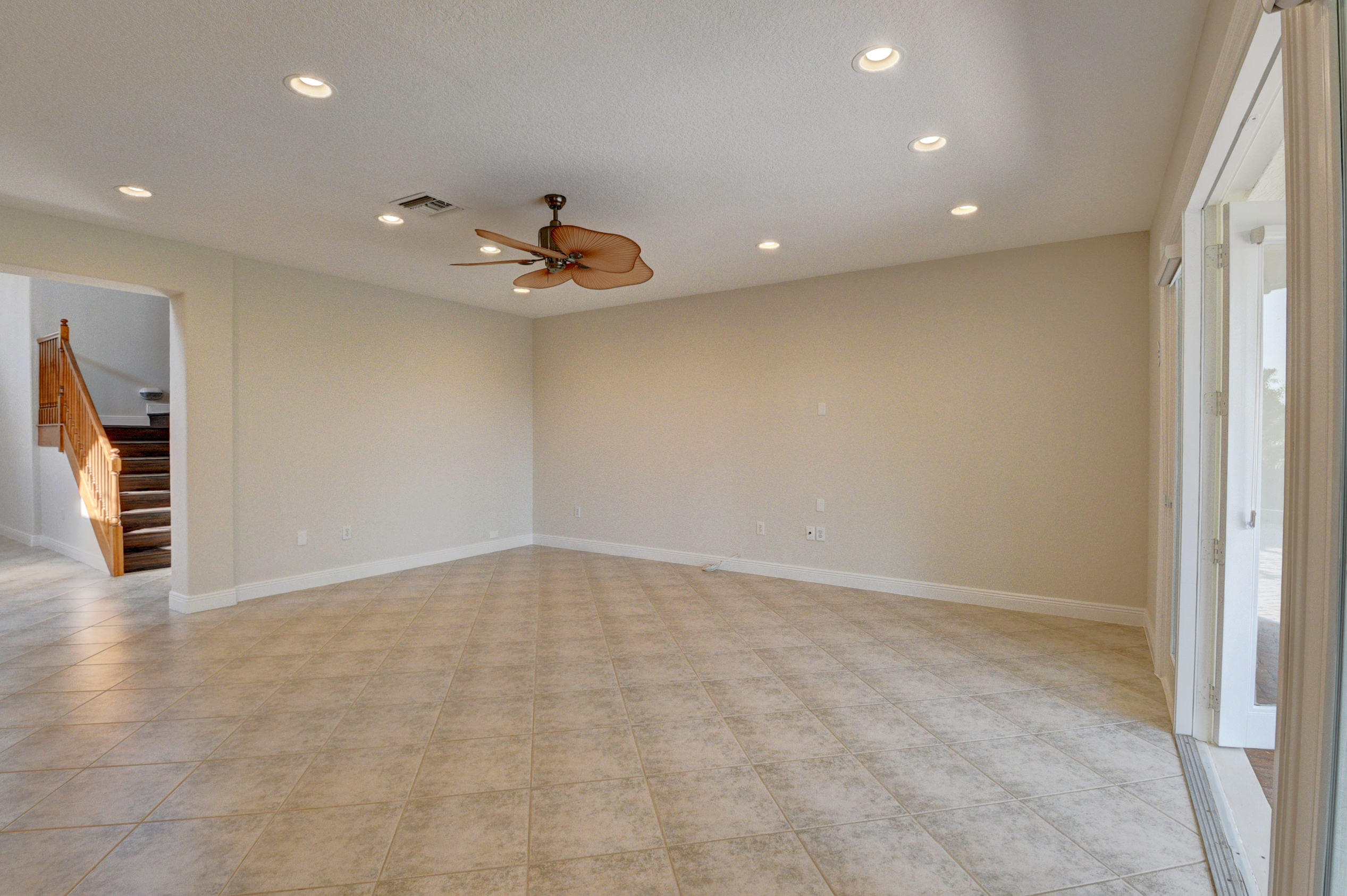 11785 Preservation Lane Boca Raton, FL 33498 - Photo 14 of 53 an empty room with wooden floor and windows