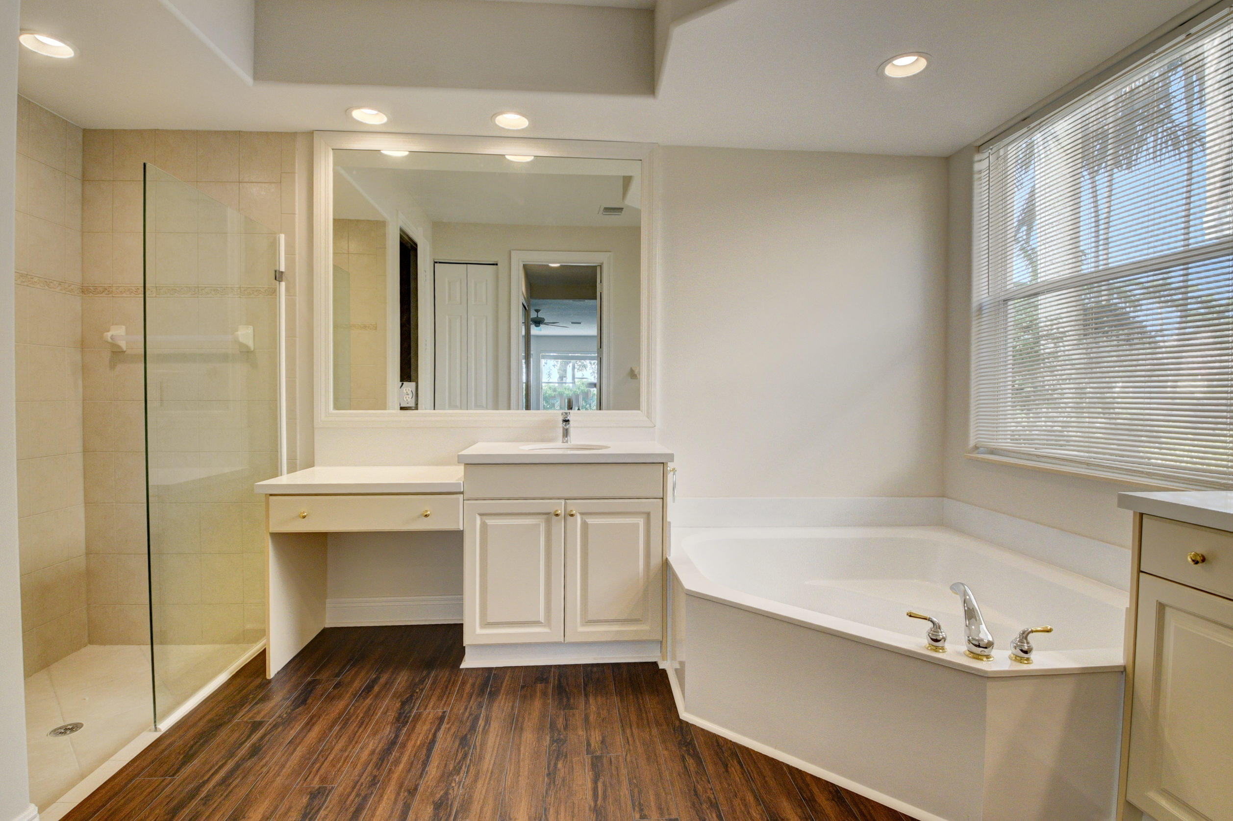 11785 Preservation Lane Boca Raton, FL 33498 - Photo 17 of 53 a bathroom with a bathtub and a sink