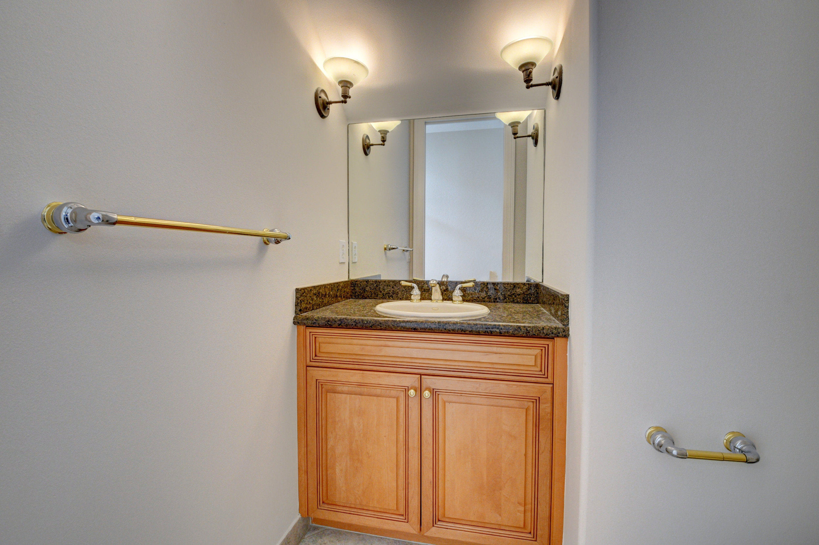 11785 Preservation Lane Boca Raton, FL 33498 - Photo 21 of 53 a bathroom with a granite countertop sink and a mirror