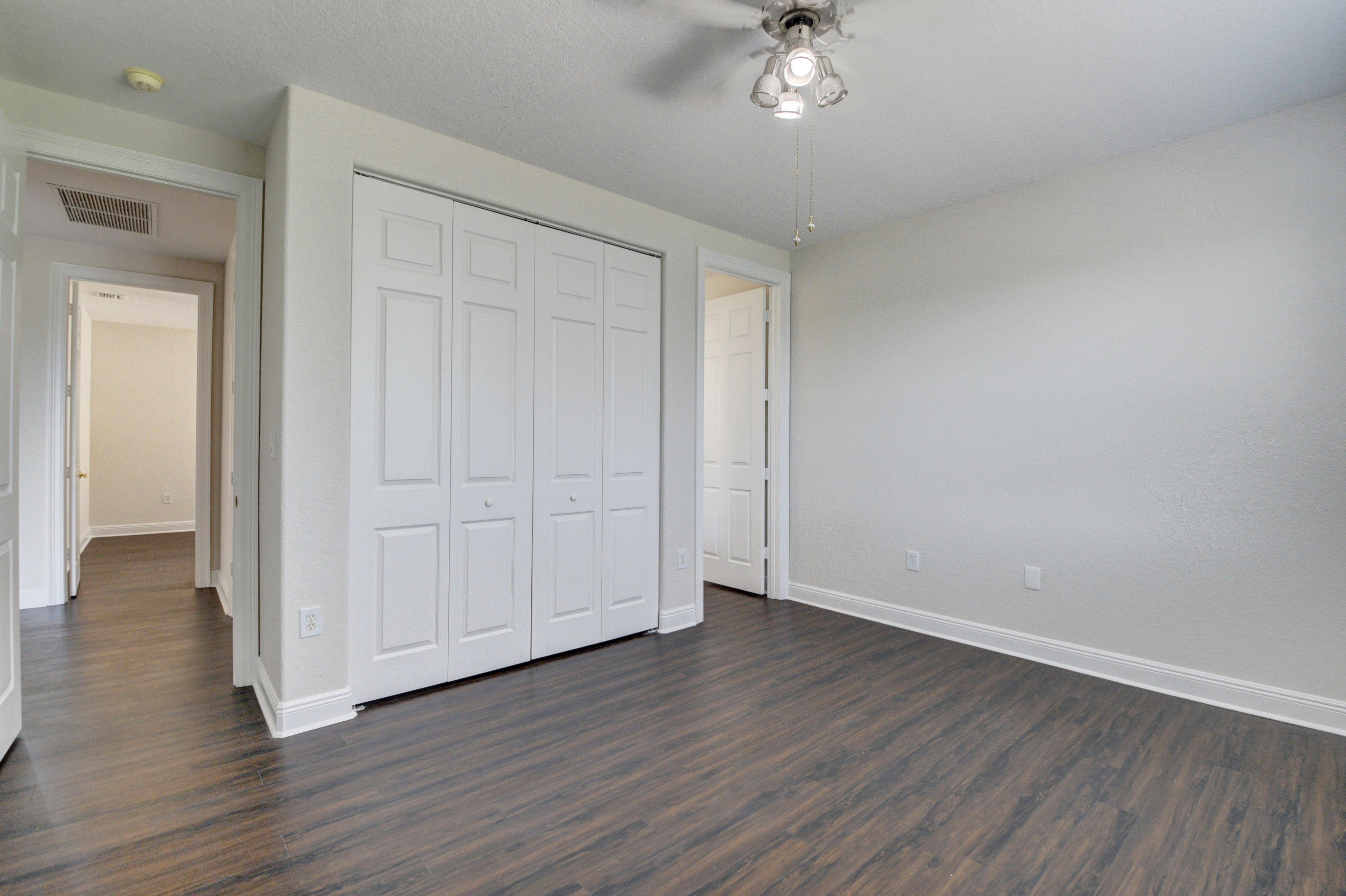 11785 Preservation Lane Boca Raton, FL 33498 - Photo 29 of 53 a view of an empty room with wooden floor